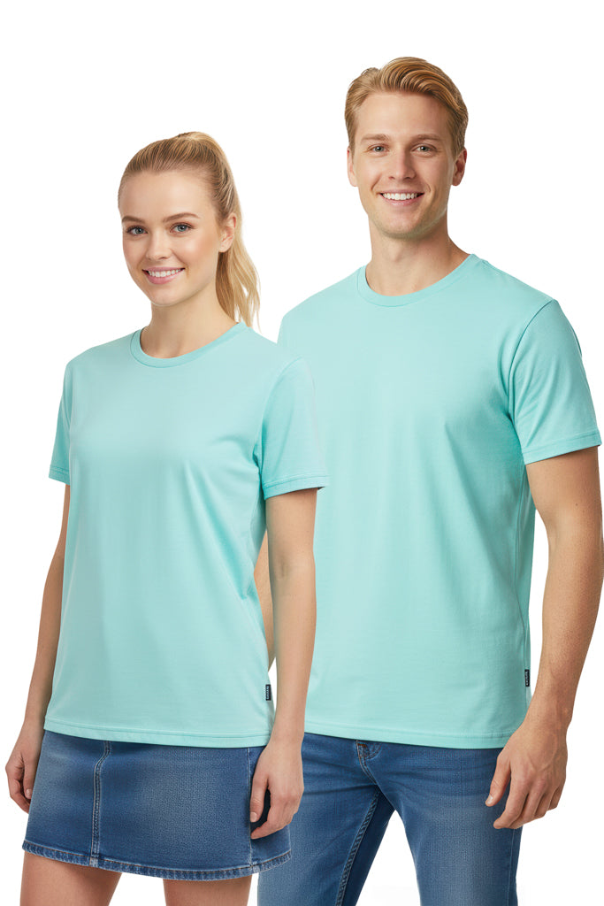 Man and woman smiling, wearing light blue t-shirts. The woman has a denim skirt and the man has blue jeans.