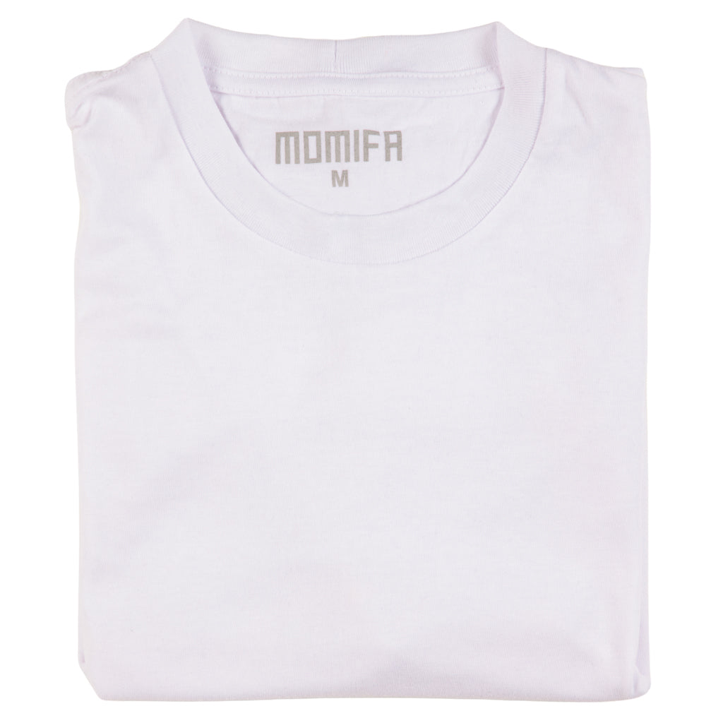 Folded white t-shirt with the "MOMIFΛ" brand logo and a size "M" tag printed on the collar.