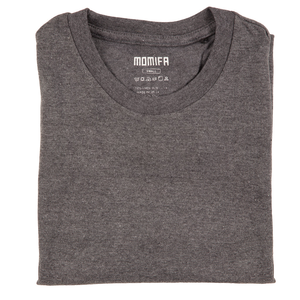 folded dark grey crew-neck t-shirt with a visible label showing the brand name "MOMIFA" and size "SMALL."