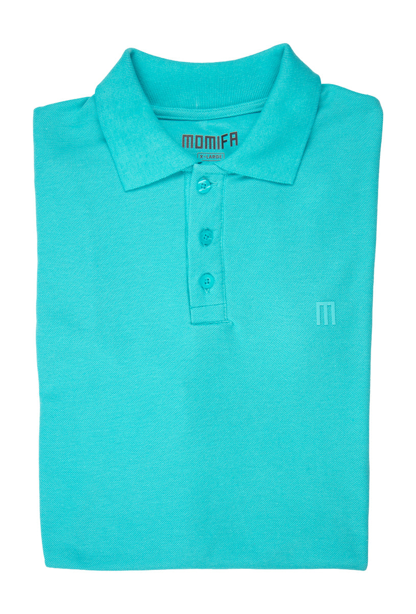 Folded turquoise polo shirt with a collar, a three-button placket, and a tonal "M" logo embroidered on the left chest.
