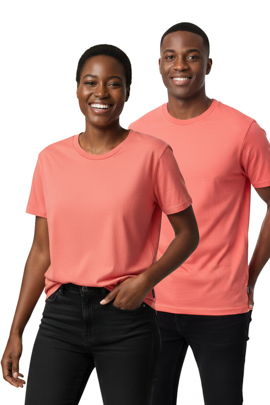 Smiling Black woman and a smiling Black man wearing matching peach-colored t-shirts and black pants.