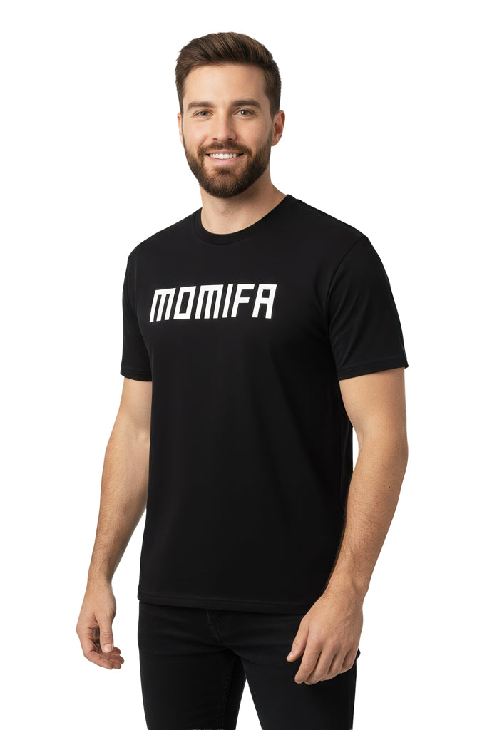 Smiling man with a beard is wearing a black t-shirt with "MOMIFA" printed on the front in white letters.