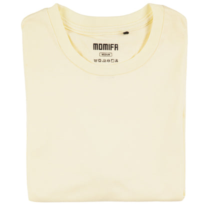 Neatly folded cream-colored t-shirt with a "MOMIFA" brand tag is displayed against a black background.