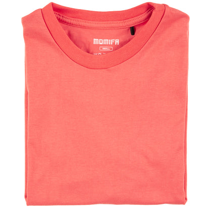 Neatly folded, reddish-orange t-shirt with a small "MOMIFR" brand label at the collar, on a white background.
