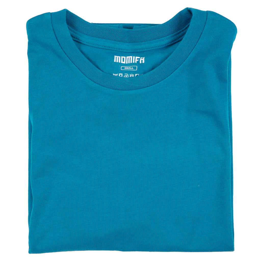 Folded teal blue t-shirt with the white "MOMIFA" and "SMALL" brand tag visible at the collar area.