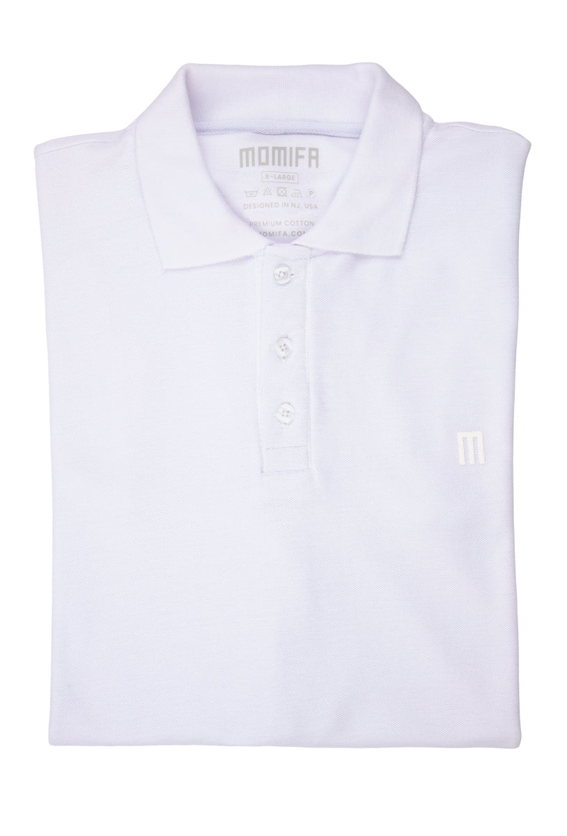 Folded white polo shirt with a collar, a three-button placket, and a subtle ""M"" logo on the left chest.