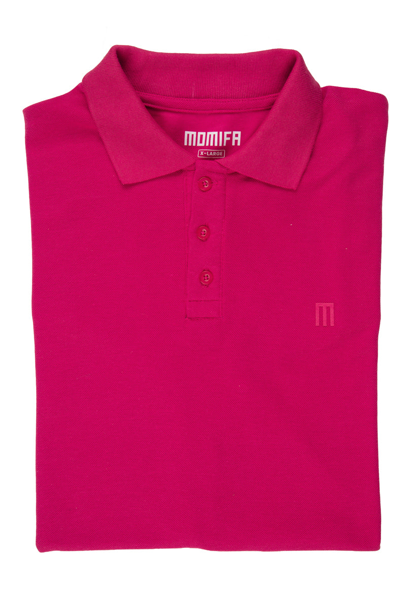 Folded pink polo shirt with a collar, a three-button placket, a "MOMIFA X-LARGE" tag, and a subtle "M" logo on the chest.