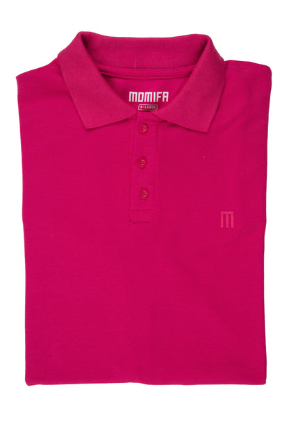 Folded pink polo shirt with a collar, a three-button placket, a "MOMIFA X-LARGE" tag, and a subtle "M" logo on the chest.